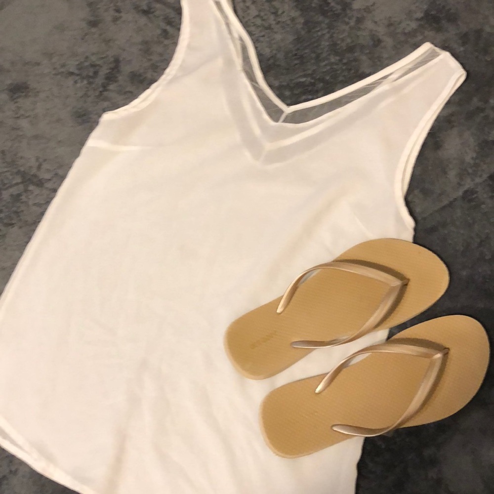White semi sheer tank top. Fits like a Small